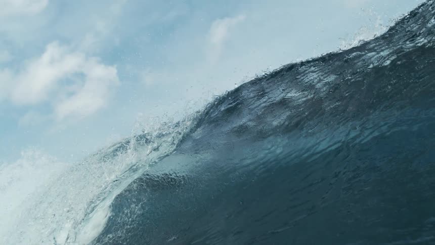 Underwater view of the ocean with heavy waves forming above