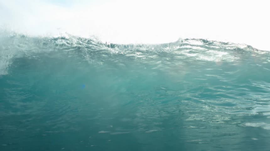 Wave breaking in slow motion then panning underwater