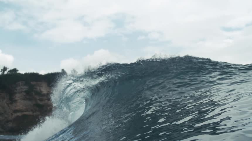 An ocean with heavy waves forming at midday