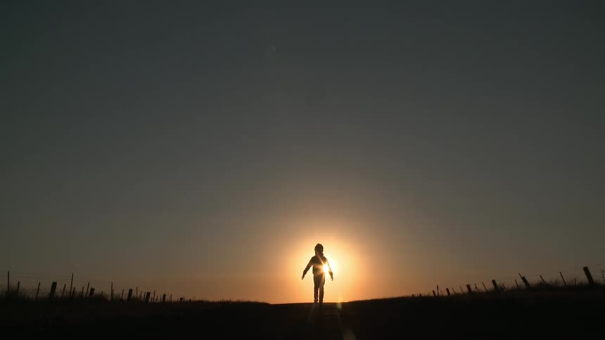 A person standing in front of the horizon