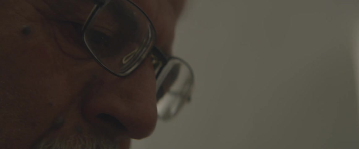 Eyes and nose of man wearing glasses