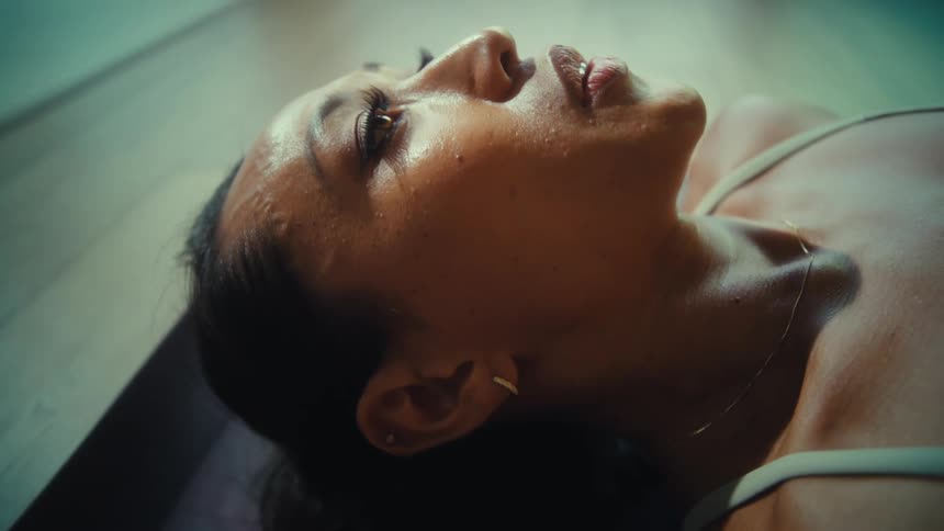Woman lying down taking deep breaths