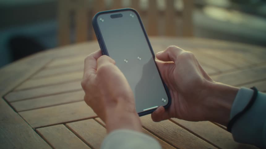 Pair of hands interacting with a smartphone
