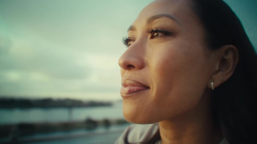 Profile portrait of a woman in an outdoor setting