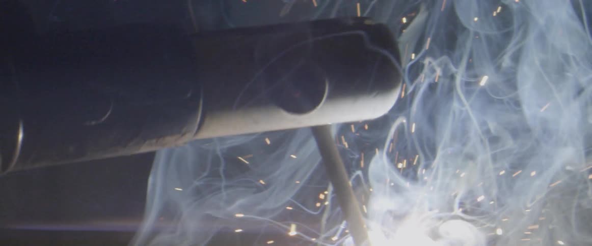 Sparks fly from a welder