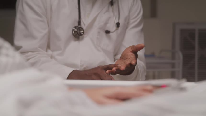 Pair of hands giving an explanation to a person