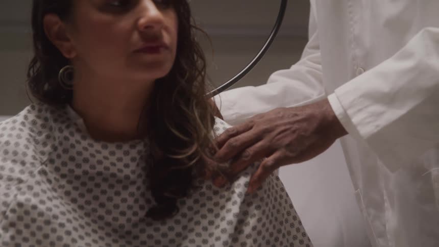 Woman patient sitting at a doctor checking