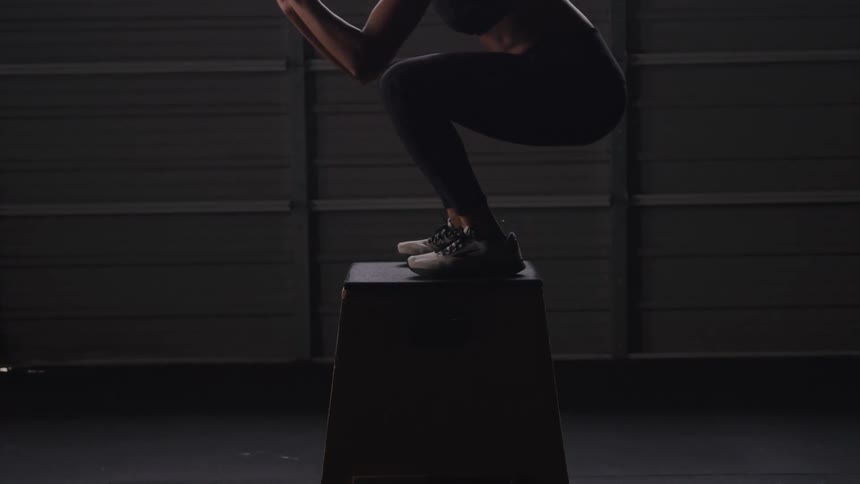 A woman is working out in the gym