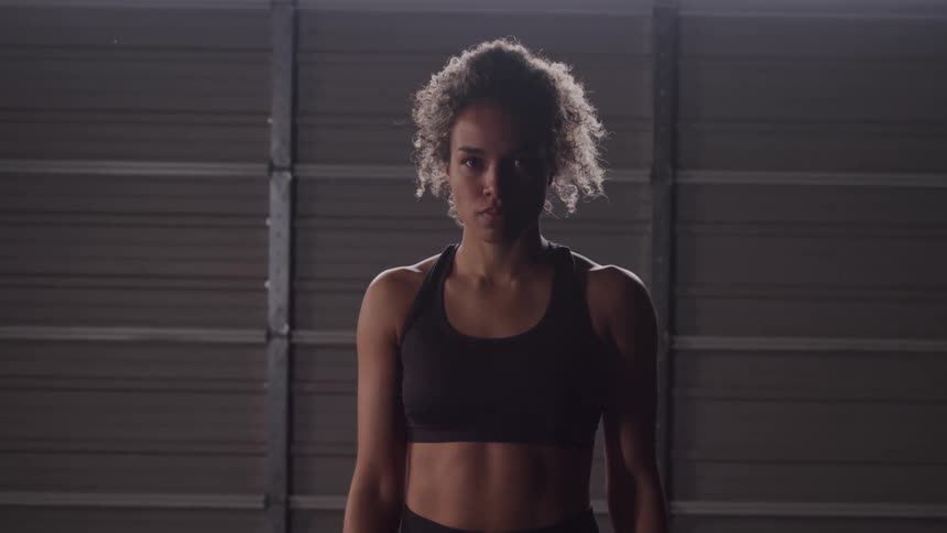 Woman with curly hair in an indoor space