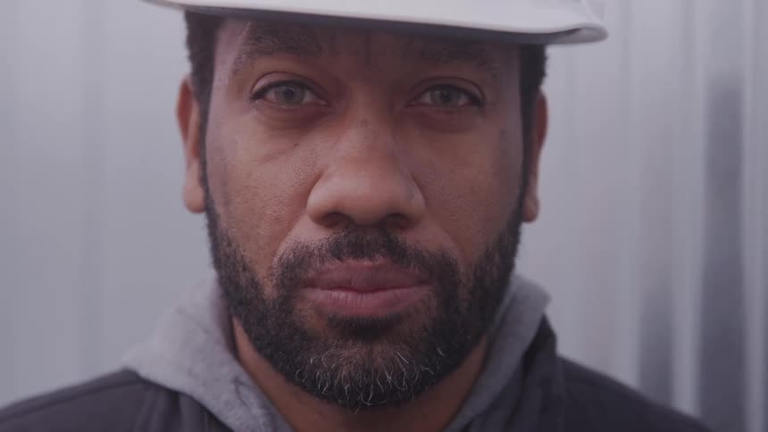 Portrait of a man in a white protective helmet
