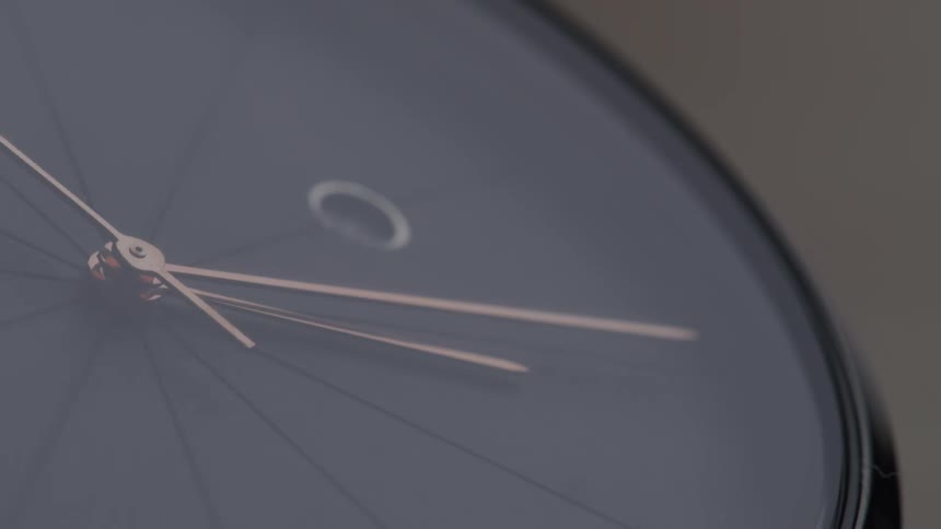 Close up of second hand sweeping around clock face