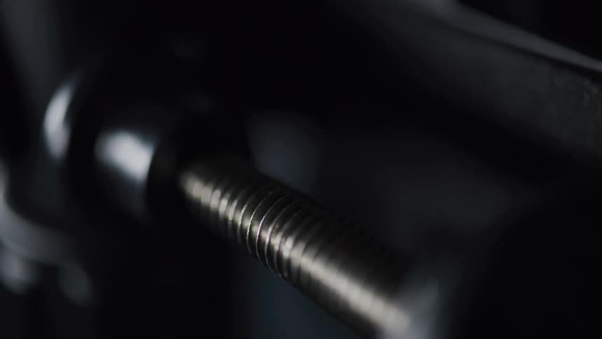 A long bolt is on the machine