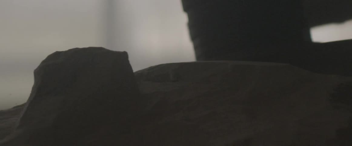 A sander is carving stone