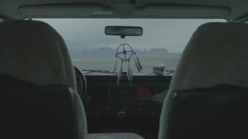 A dream catcher inside of a car