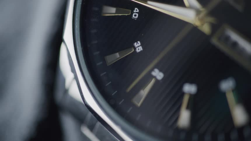 Close up second hand moving clockwise on wrist watch