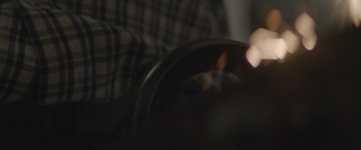 Sparks fly as a person uses a lathe