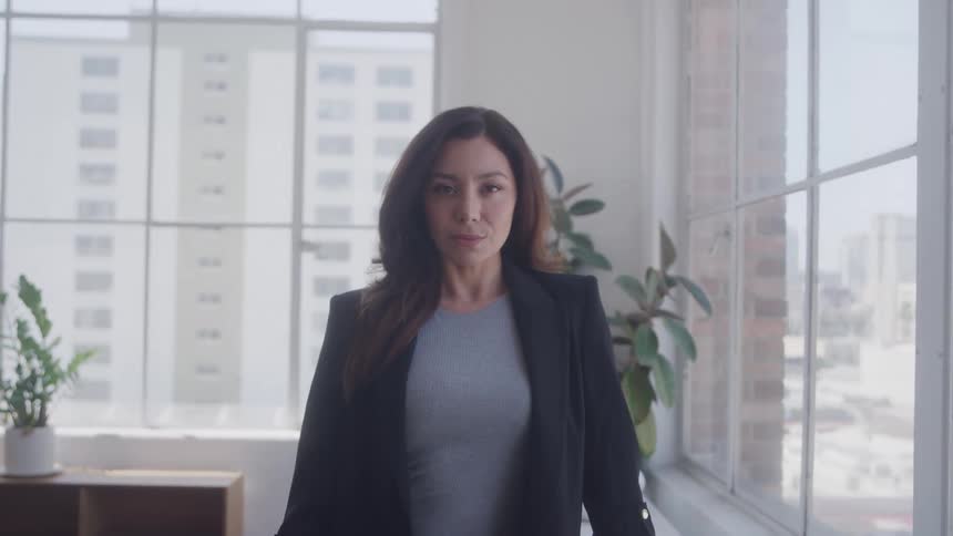 A woman looks at the camera