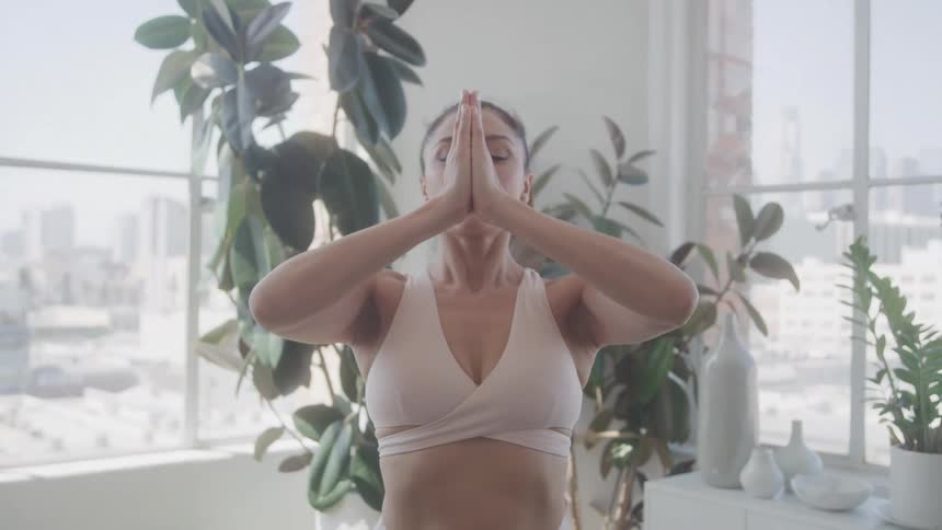Woman in an indoor space doing yoga pose