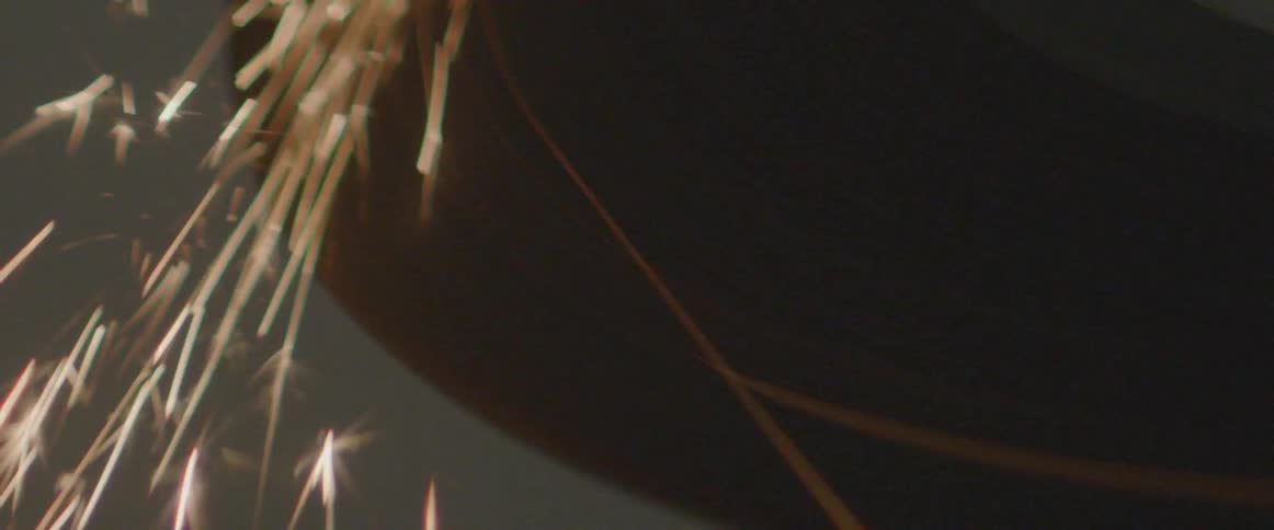 Sparks fly from a welder