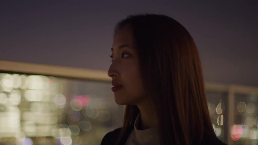 Woman in an outdoor setting at night