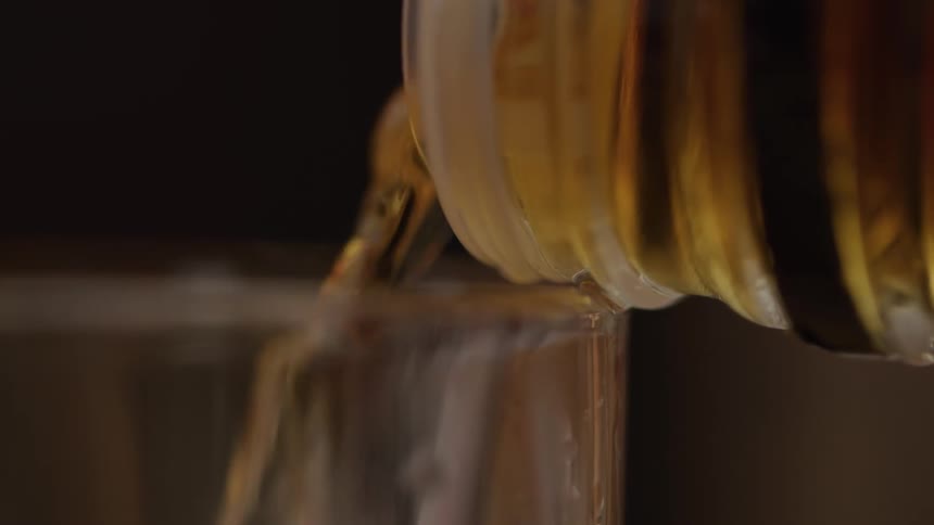 Alcohol being poured into a glass