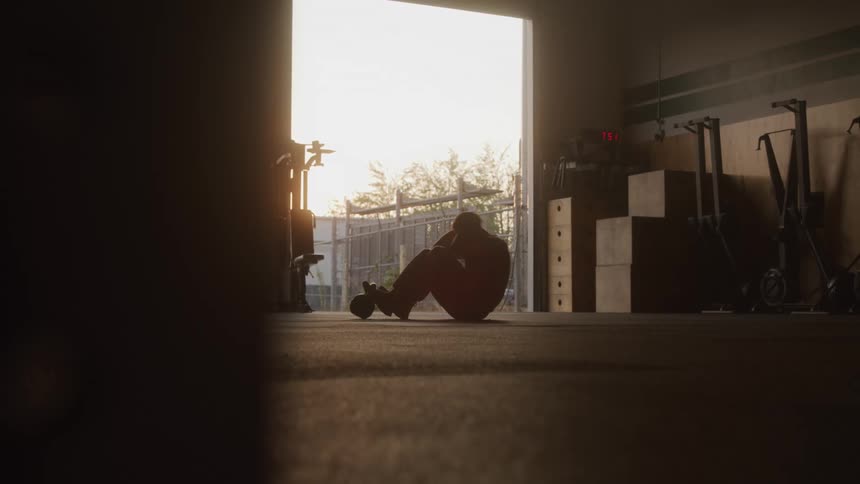 A person is exercising at a empty indoor place