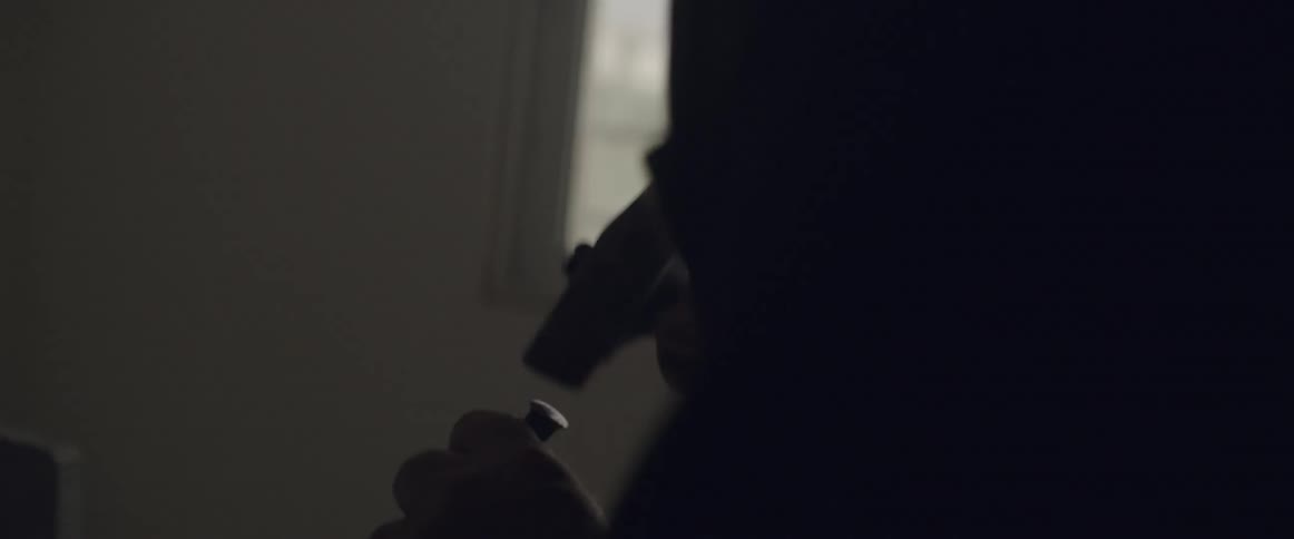 A man hammers a chisel