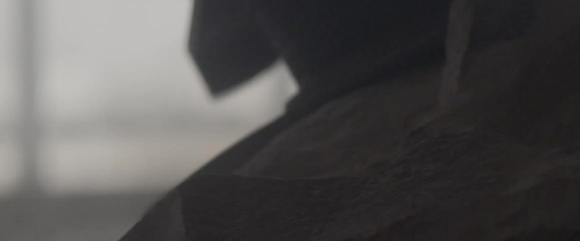 A grinder is used to smooth a rock