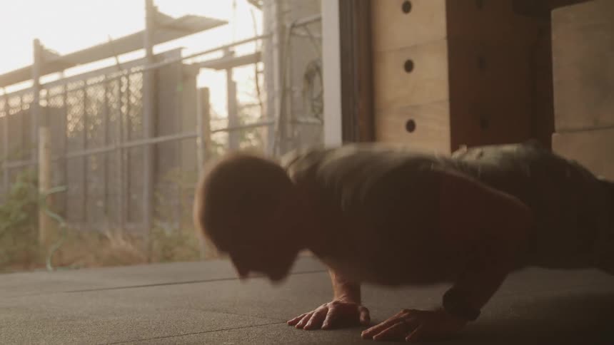 A footage of a man doing some push ups