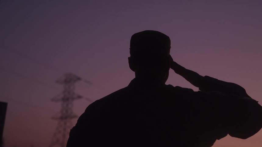 Silhouette of a military man giving the salute sign
