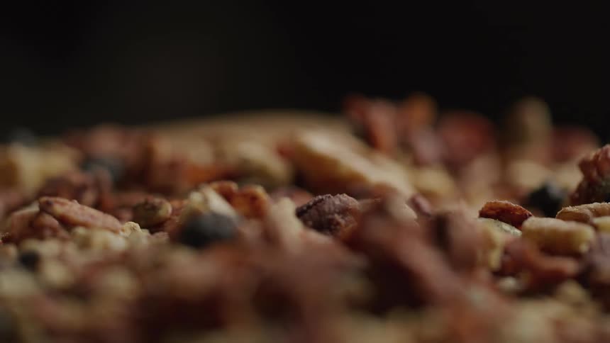 A peperoni pizza prepared and placed in an oven