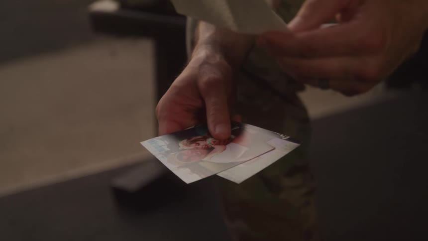 Pair of hands looking at photographs