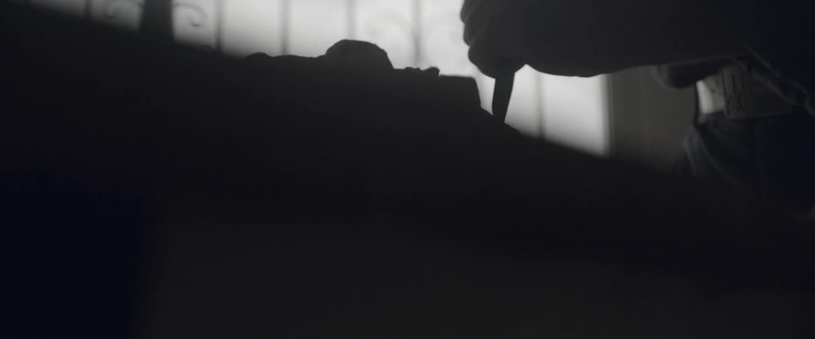 A person is using a chisel to sculpt a stone
