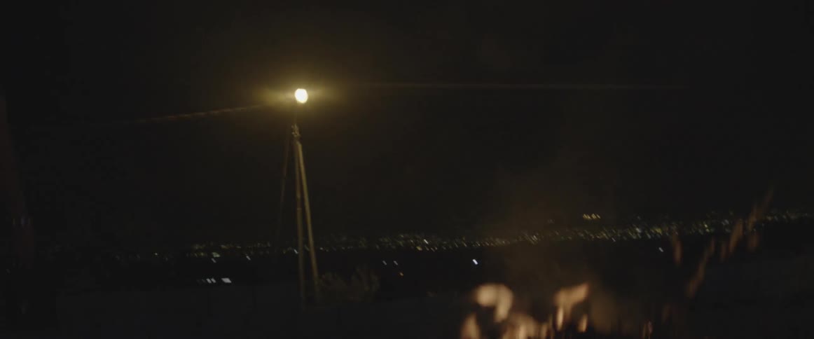The fire is burning bright into the night sky