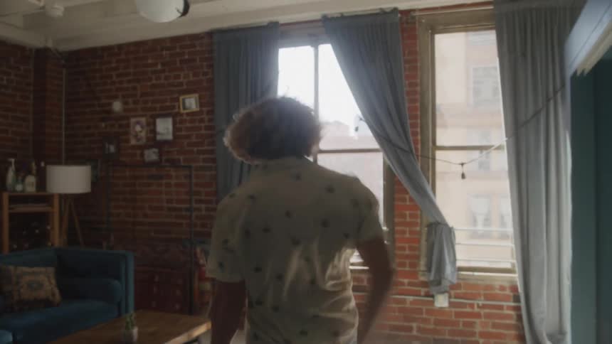 Angry man walking through rooms of the house