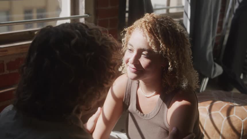 Couple sitting and looking at each other in a romantic moment
