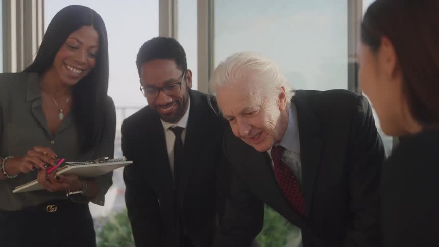 Group of smiling businesspeople in an office room