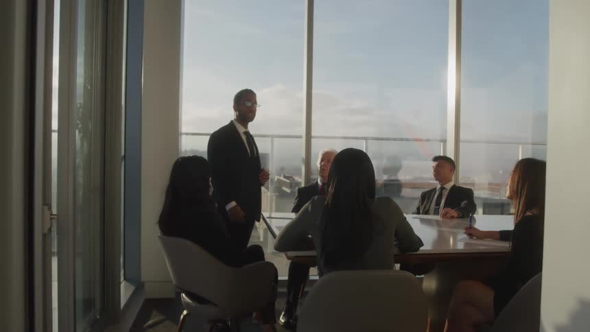 A group of professionals are having a meeting in a modern conference room
