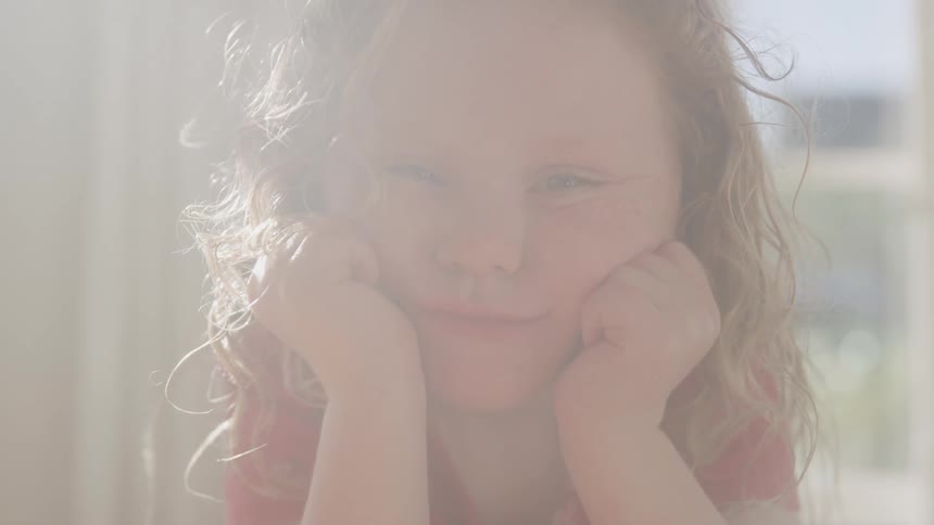 The girl is smiling on a sunny day