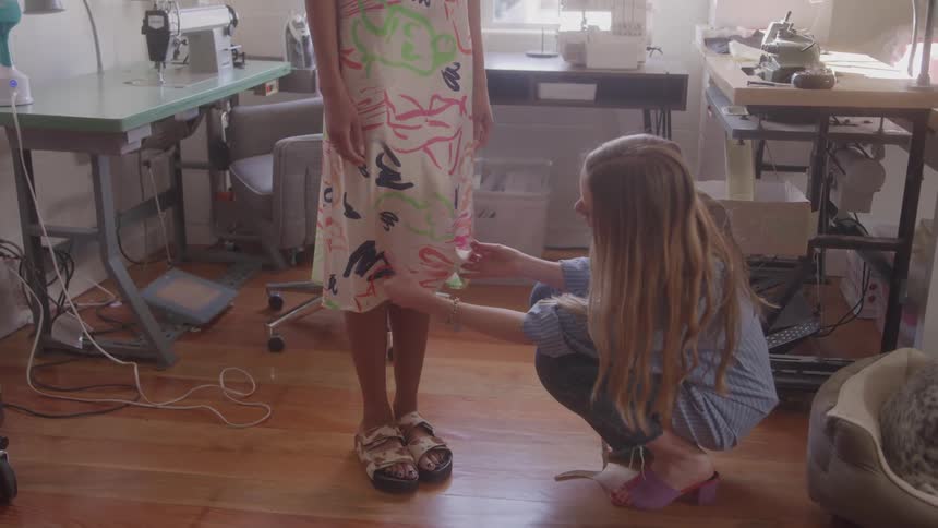 Dressmaker who alters a customers dress