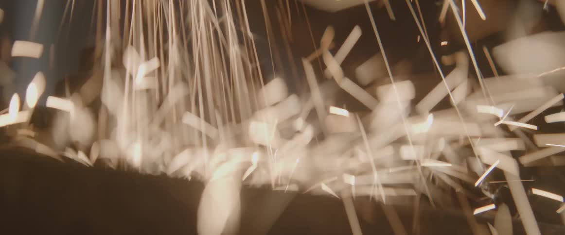 A shower of sparks fly downwards