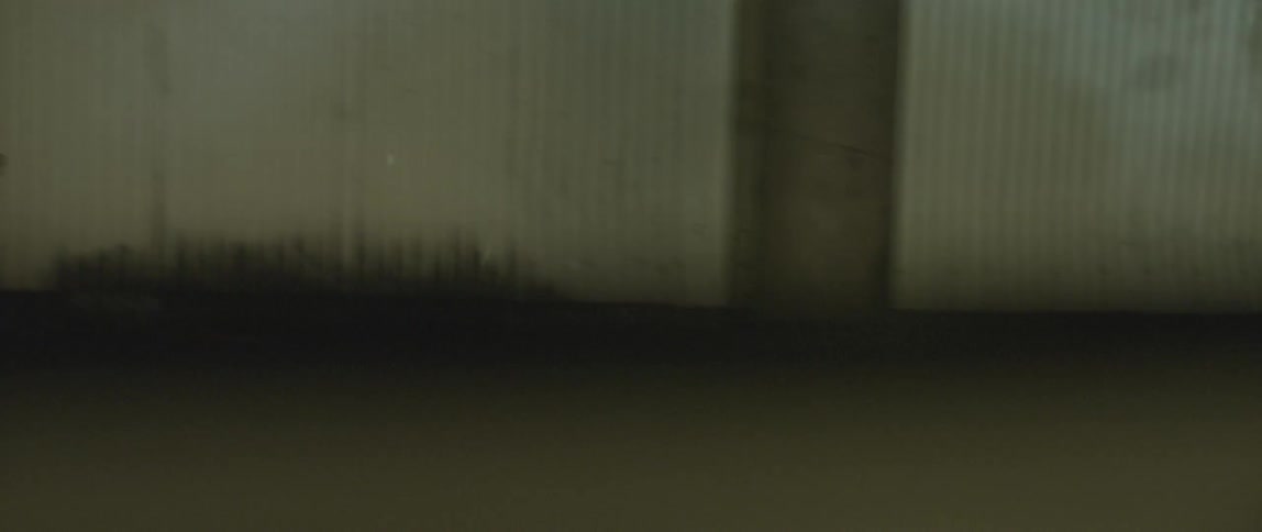 The side of a building and windows is shown