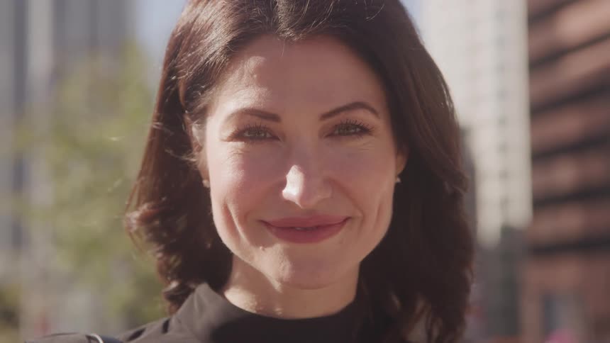 Portrait of a woman outdoors with a happy expression