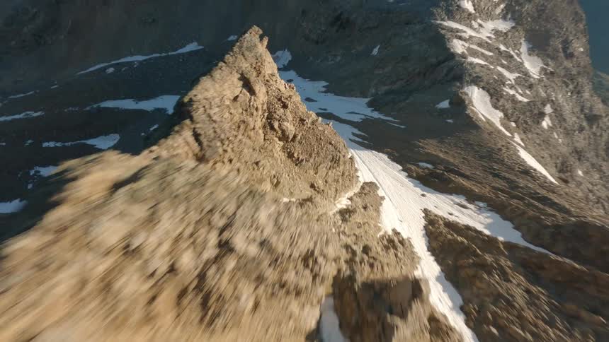 Aerial view of snowcapped mountain and rocky peaks in switzerland