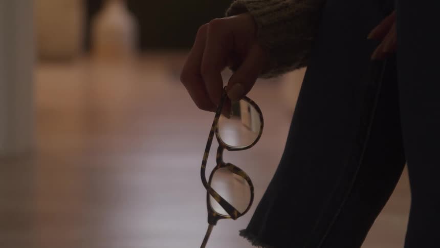 Persons hand holding glasses