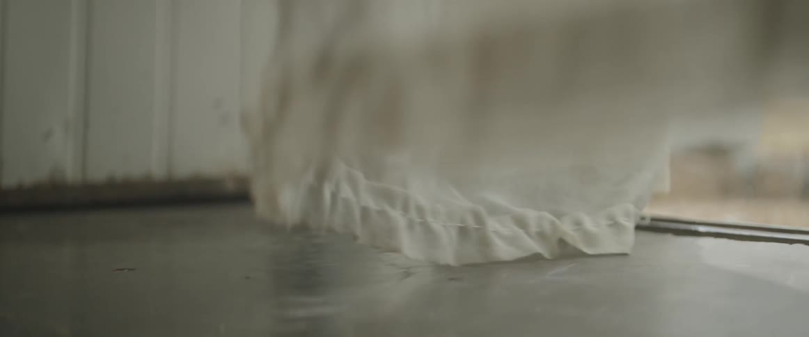 Curtains flutter in a breeze