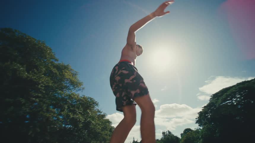 The teenager balances on the edge of the bridge