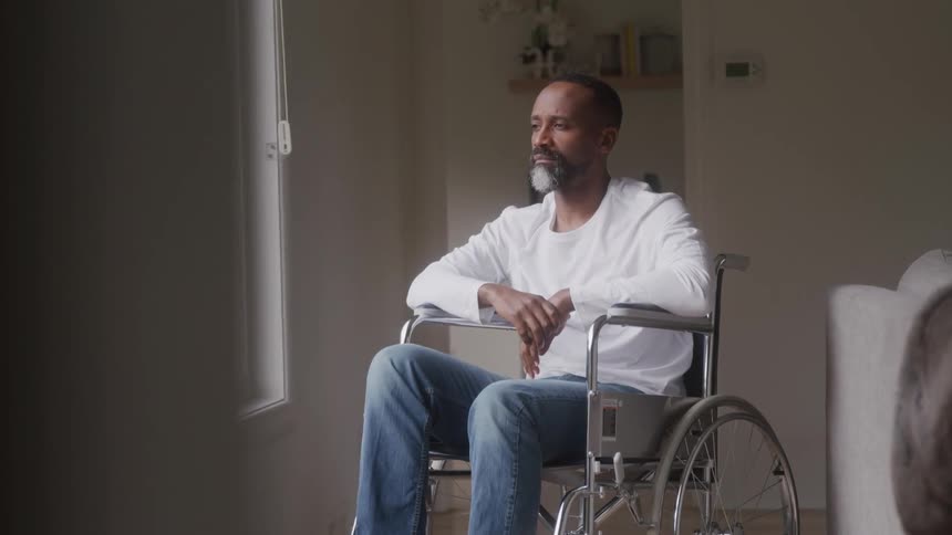 Man in wheelchair in a hospital room