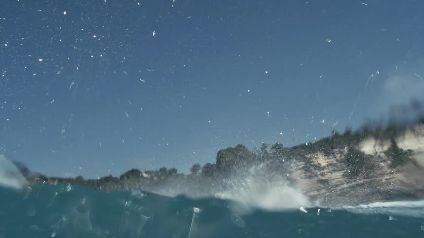 Underwater view of a wave passing by
