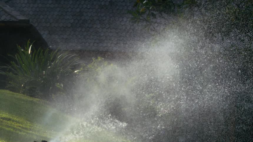 Water being spread over a houses garden